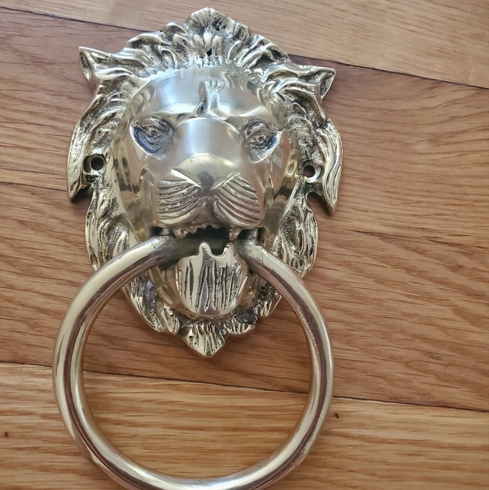 NEW AND UNUSED Brass lion head door knocker
